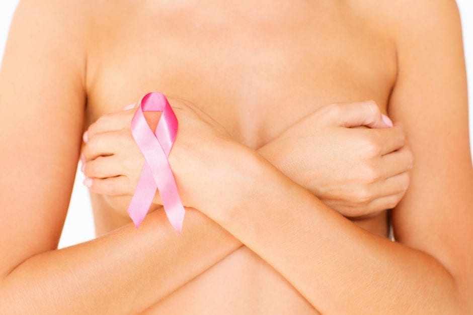naked woman with breast cancer awareness ribbon