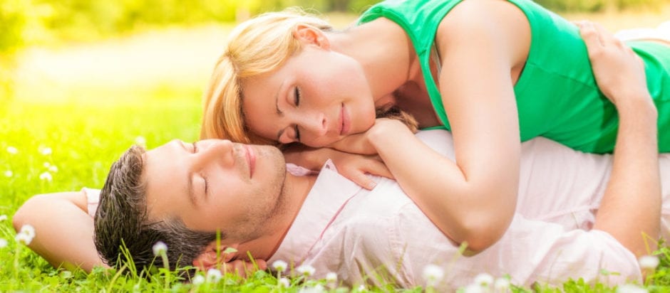 couple in the grass sleeping