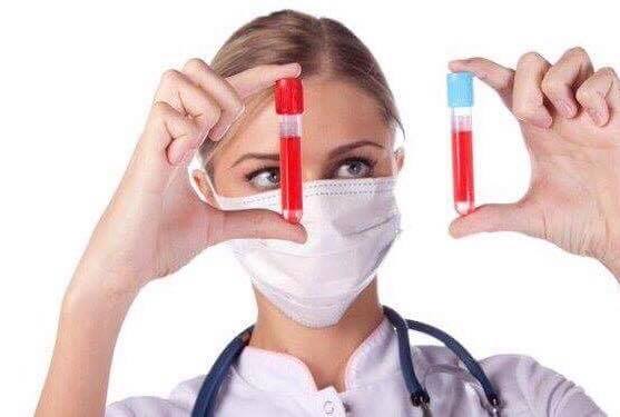 doctor looking at blood samples