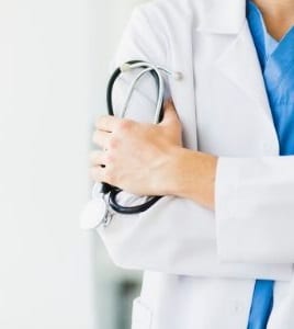 Σχετικά με εμάς Doctor holding his own arm and a stithoscope